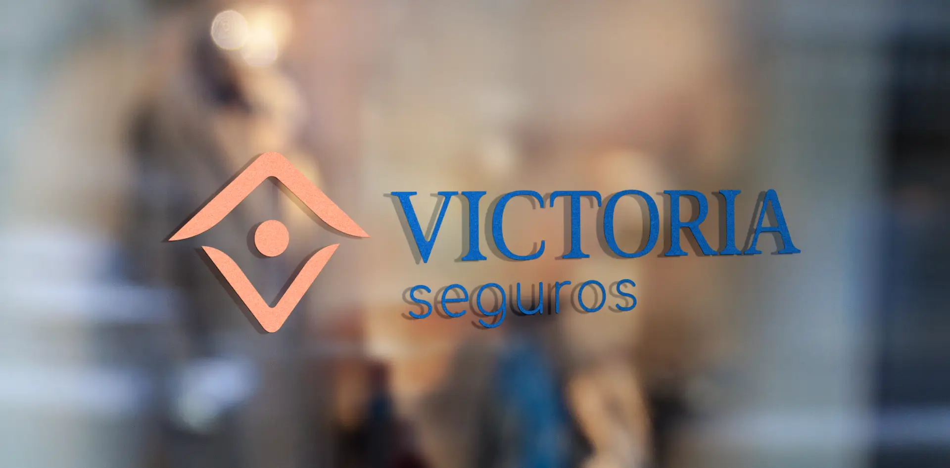 Primary logo variation for Victoria Seguros, an insurance agent’s personal brand, displayed on her office window, showcasing a professional and recognizable logo variations for brand consistency.